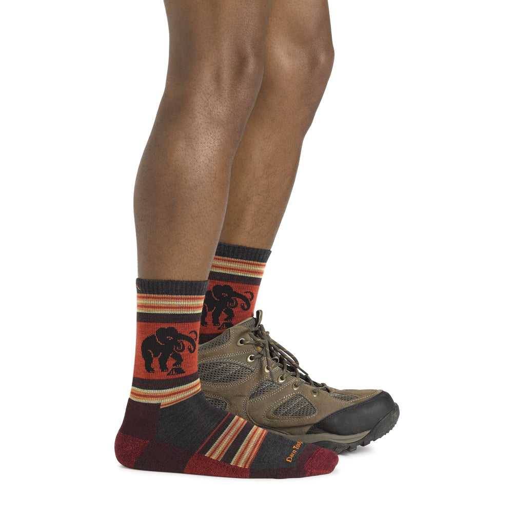 a man is standing on a skateboard with his feet