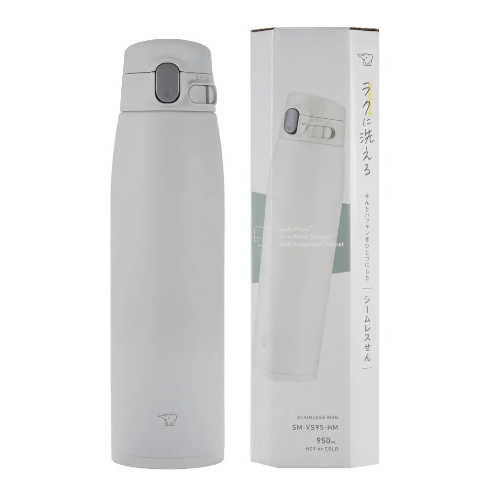 Botella térmica Zojirushi SM-VS95 gris claro de 950 ml junto a su caja de embalaje blanca con imagen del producto.