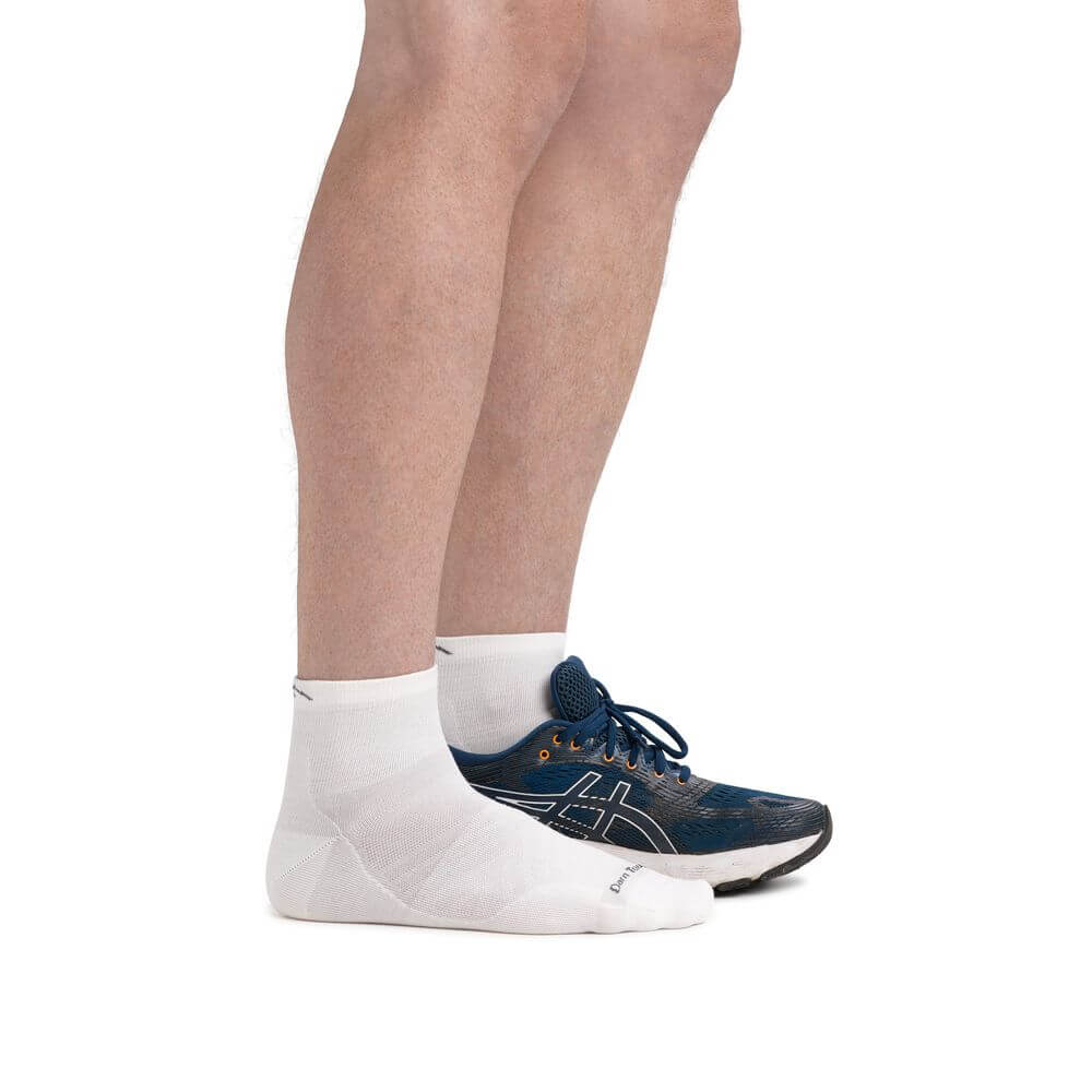 a person wearing a pair of shoes on a bench
