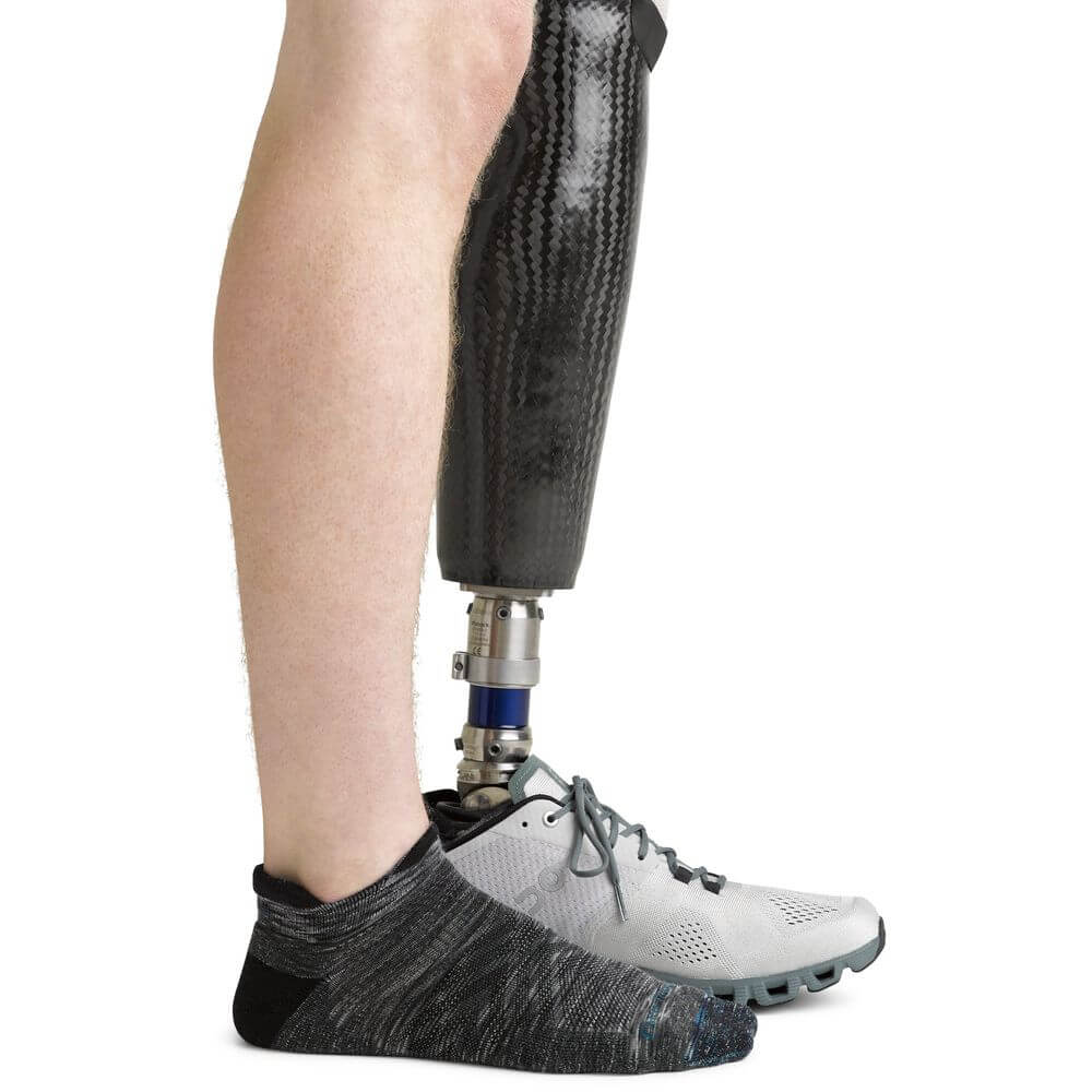 a person is holding a skateboard in their hands