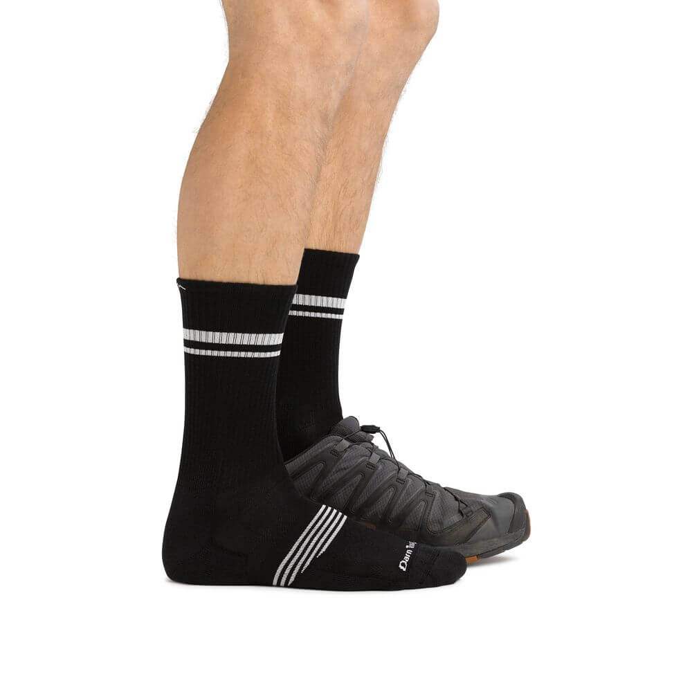 a close up of a person wearing black shoes
