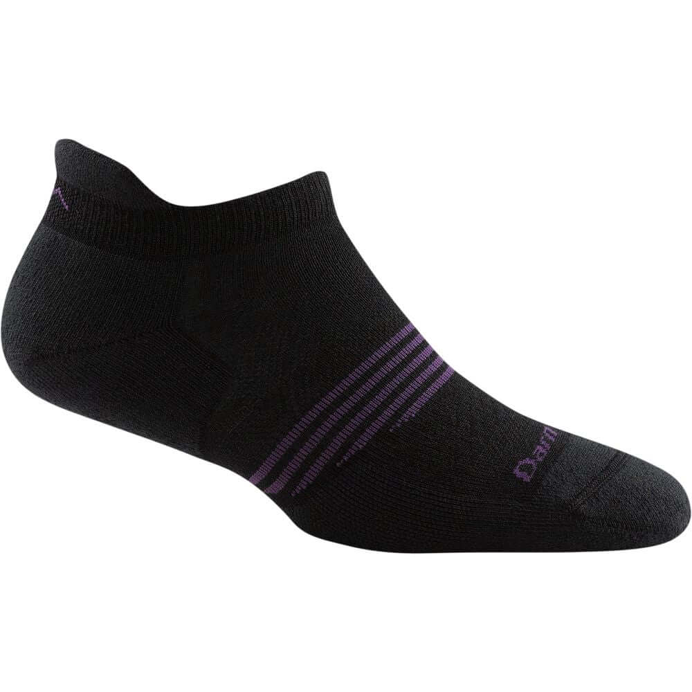 a pair of black shoes sitting on top of a bench