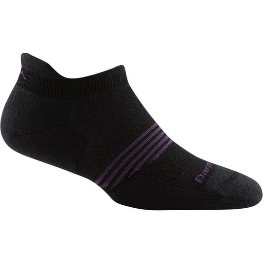 a pair of black shoes sitting on top of a bench