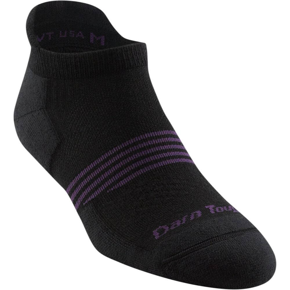 a persons feet with black and black shoes