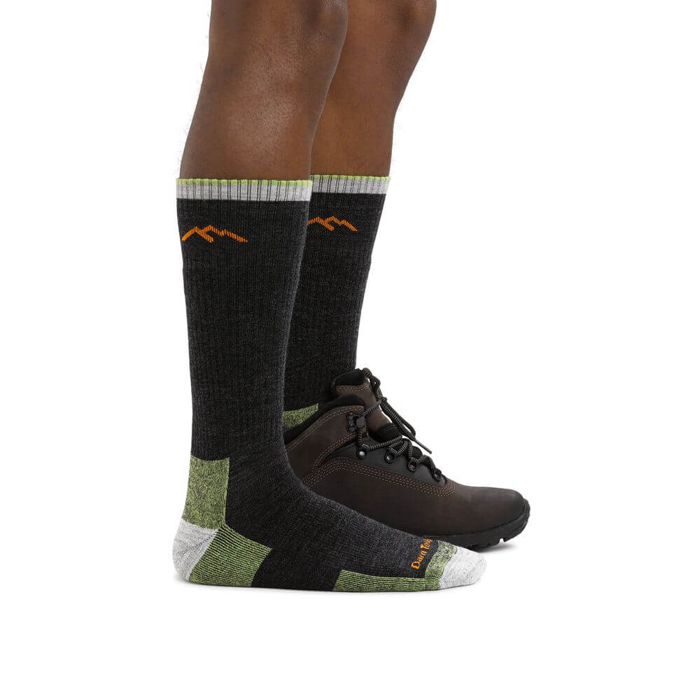 a person wearing a pair of black shoes