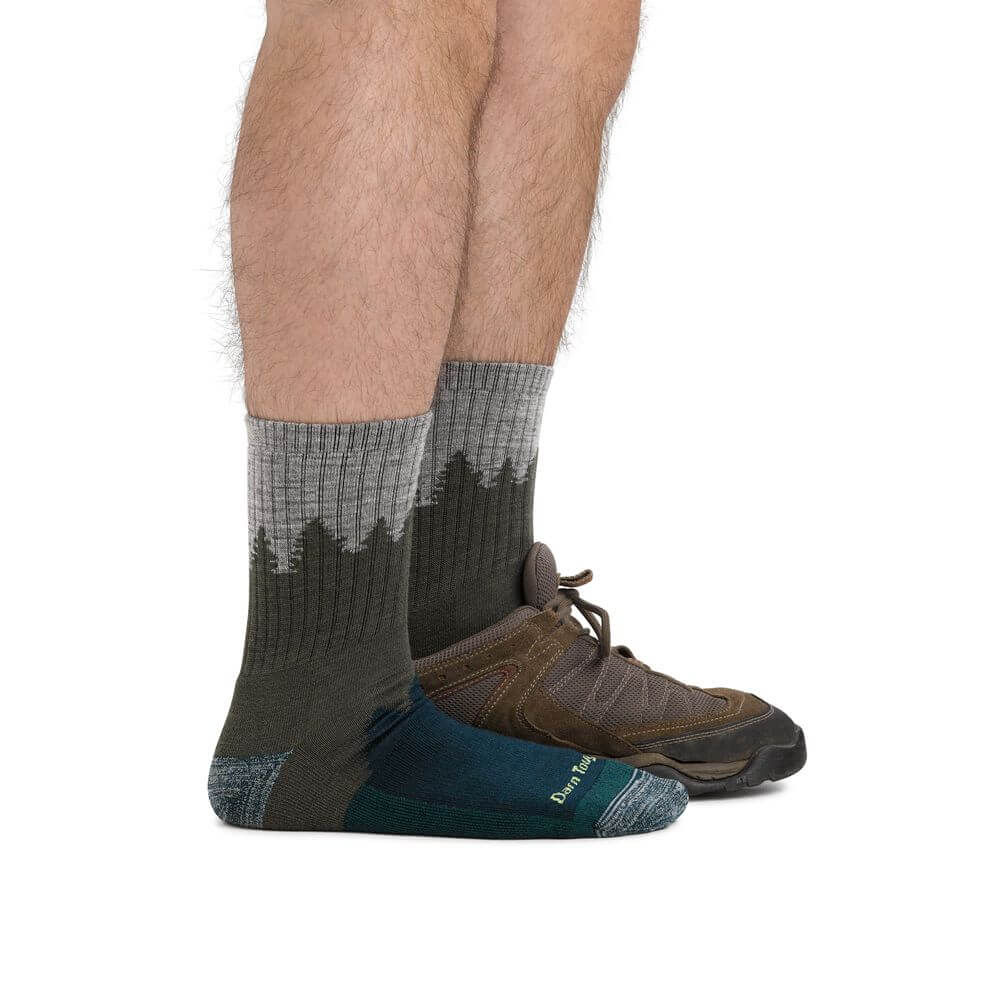 a man wearing a pair of shoes on a bench