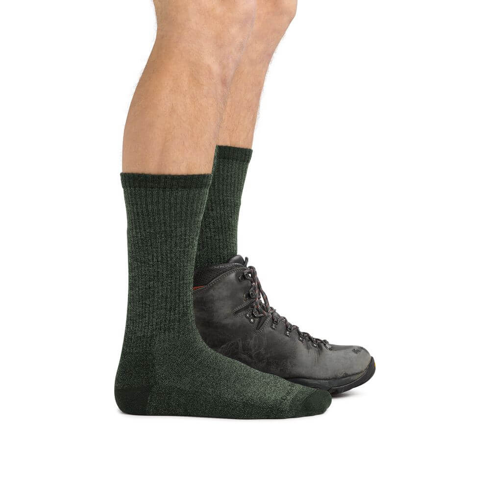 a person wearing a pair of black shoes