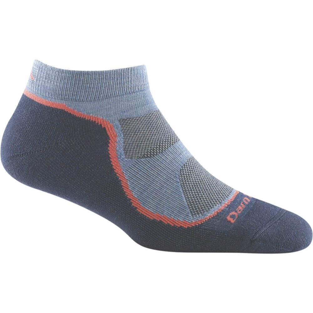 a persons feet with red and black shoes