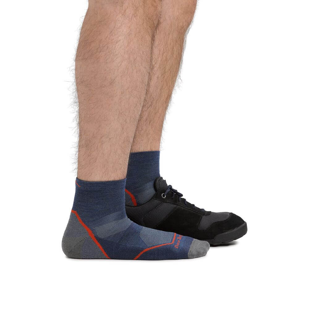 a person is standing on a bench with a skateboard