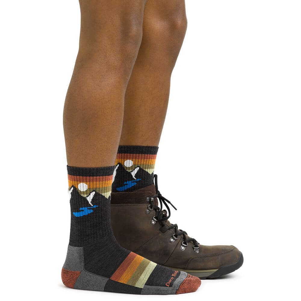 a man is standing on a skateboard with his shoes