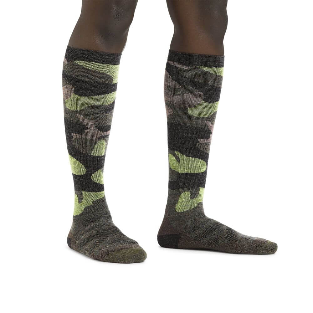 a person standing on a bench with a skateboard