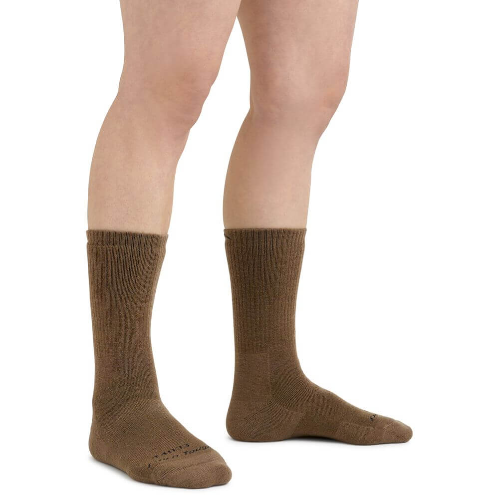 a woman wearing a skirt on a wall