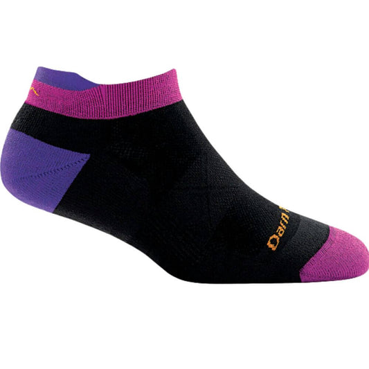 a persons feet wearing a black hat