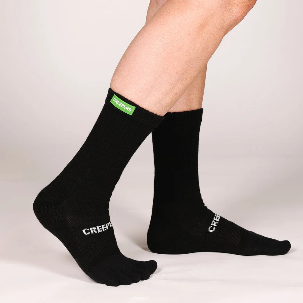 Calcetines de dedos de caña alta negros de Creepers con acolchado y logo en la parte superior