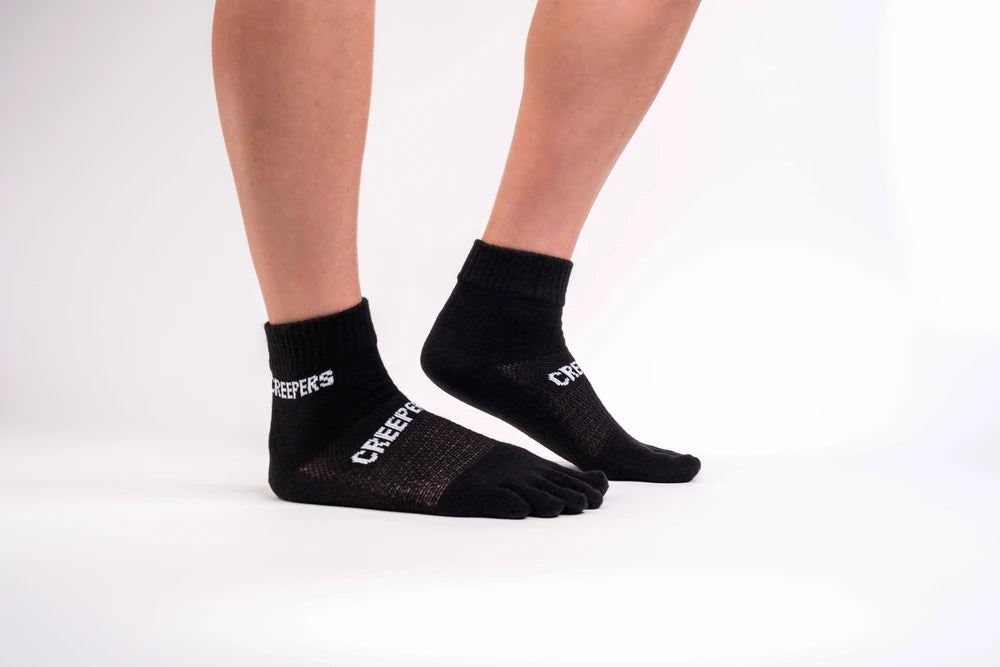 Calcetín de dedos negro Creepers Quarter Merino para running y trail con diseño ligero y altura tobillero