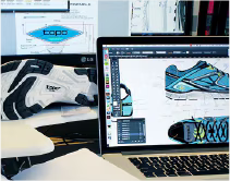 Pantalla de ordenador portátil con diseño de zapatillas y suela de zapatilla al fondo